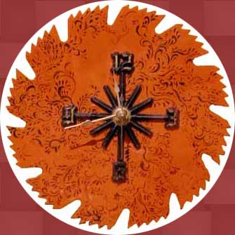 Orange Filigree Sawblade Clock